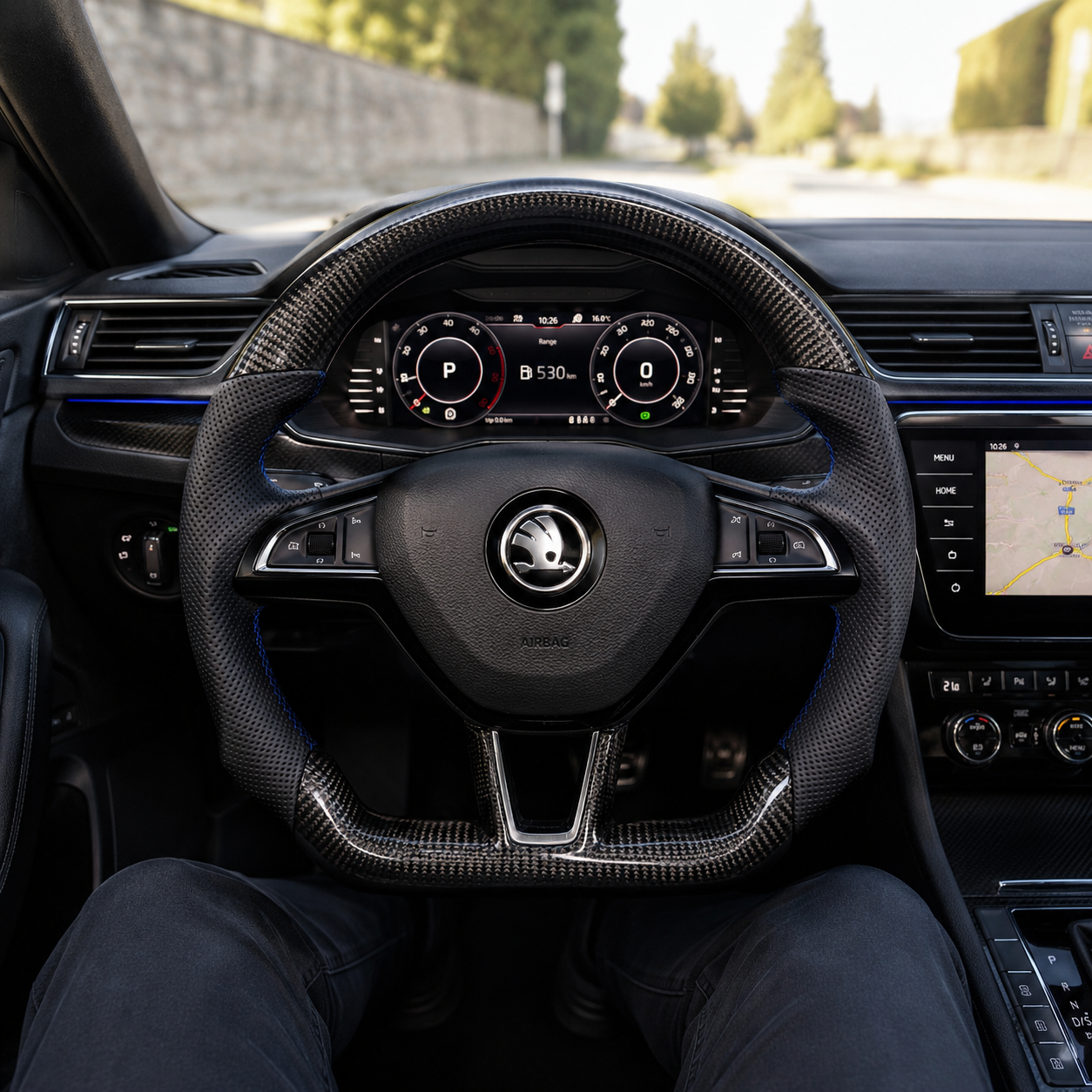 Custom carbon fiber steering wheel installed in Skoda cockpit with perforated leather grips and sport flat bottom design for Octavia 2014 2020 Superb 2015 2023 Kodiaq 2017 2024 by CJ Mod Garage