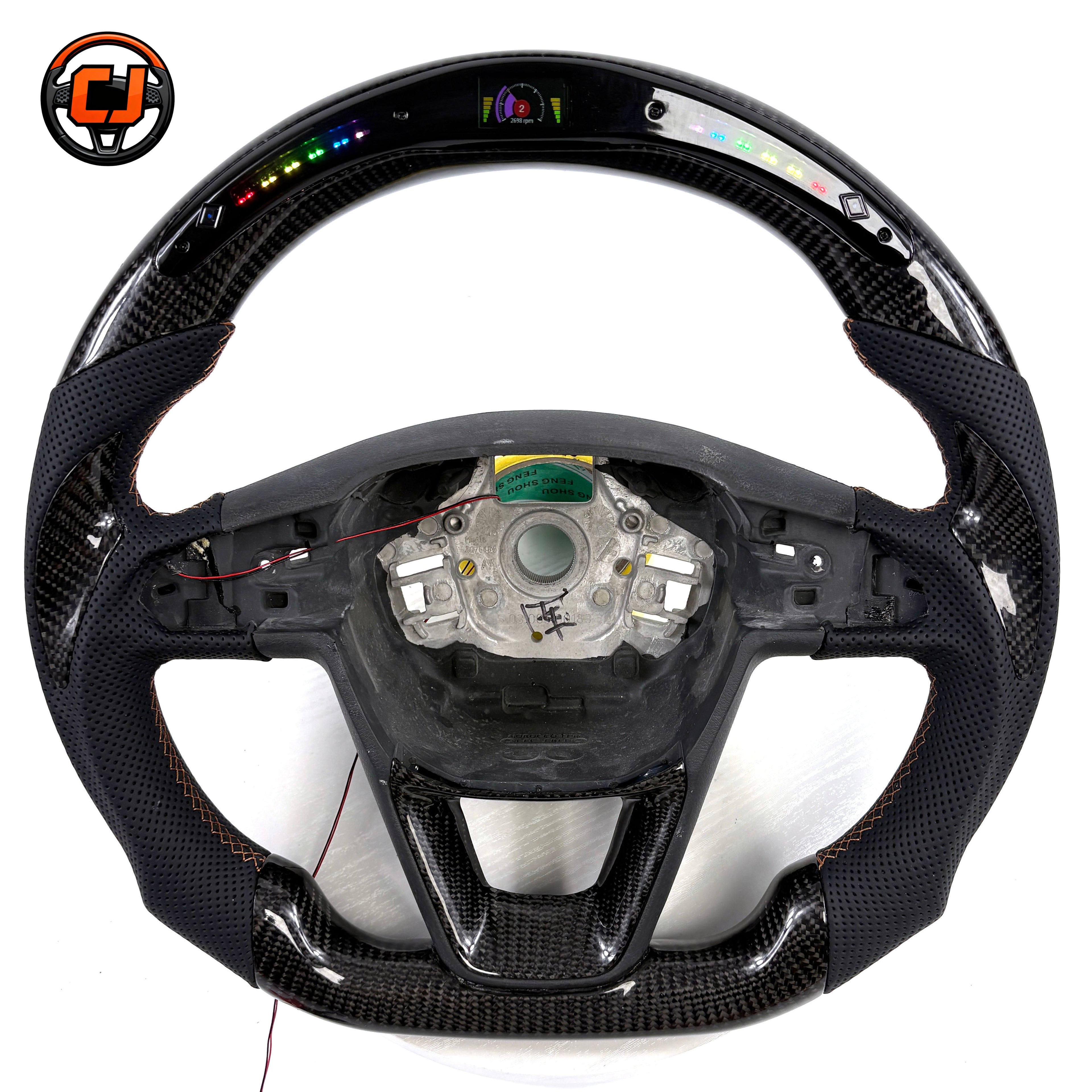 Handcrafted Seat Leon MK4 carbon fiber steering wheel with integrated buttons paddle shifters perforated leather grip and performance inspired styling by CJ Mod Garage