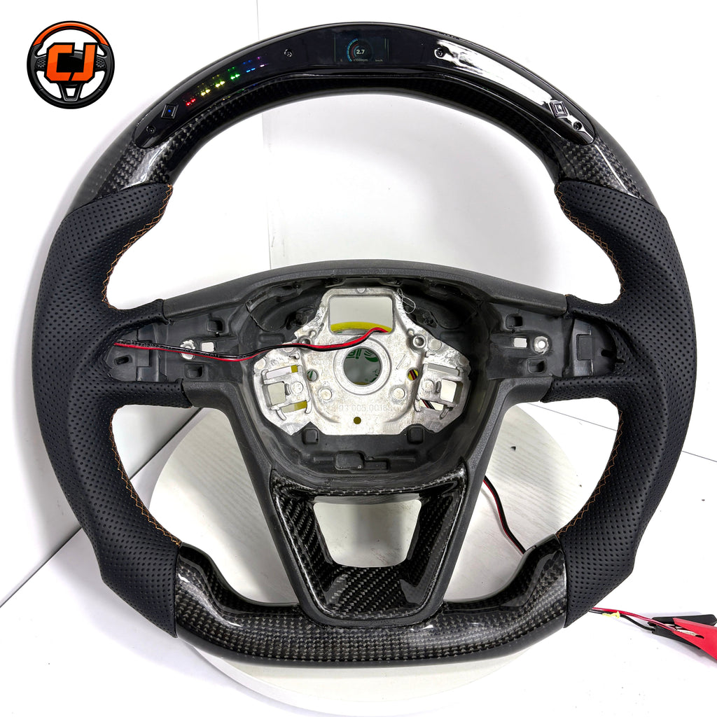 Seat Leon Cupra glossy carbon fiber steering wheel featuring perforated leather sections integrated LED display and ergonomic sport profile by CJ Mod Garage