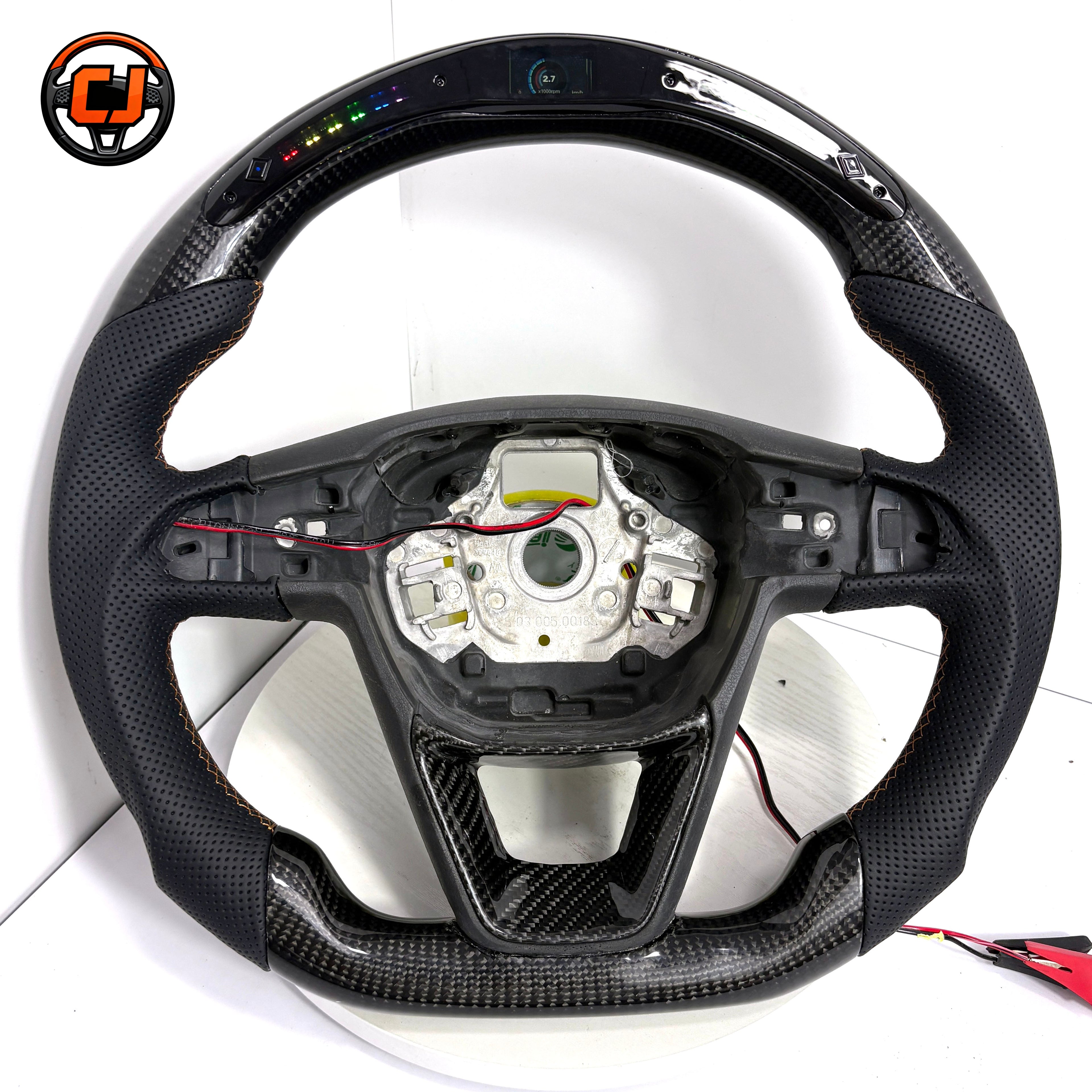 Seat Leon Cupra glossy carbon fiber steering wheel featuring perforated leather sections integrated LED display and ergonomic sport profile by CJ Mod Garage