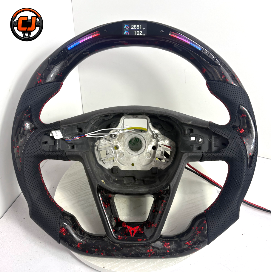 Cupra Ateca Seat Leon forged carbon fiber steering wheel with illuminated display module red flake carbon weave and sculpted leather grip profile by CJ Mod Garage