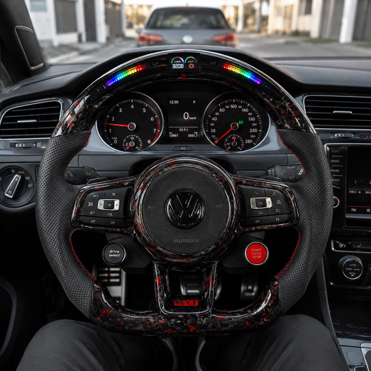 Cabin scene showing a red forged carbon LED steering wheel with round airbag for MK7 GTI Golf 6 7 7 5 R R Line CC Polo Passat B8 CJ Mod Garage