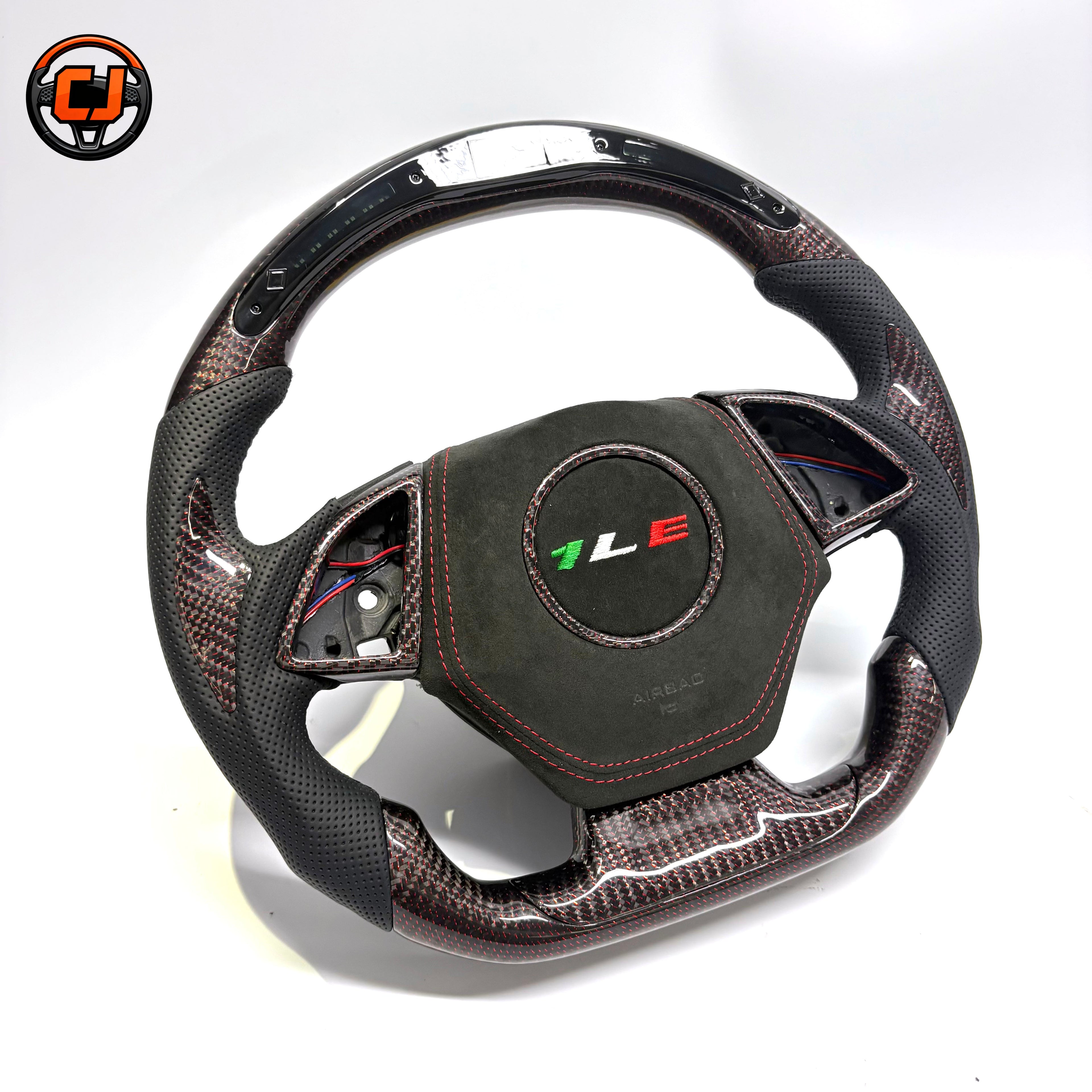Custom Chevrolet Camaro steering wheel with led display forged carbon finish perforated leather grips suede airbag cover and red stitching studio product photo