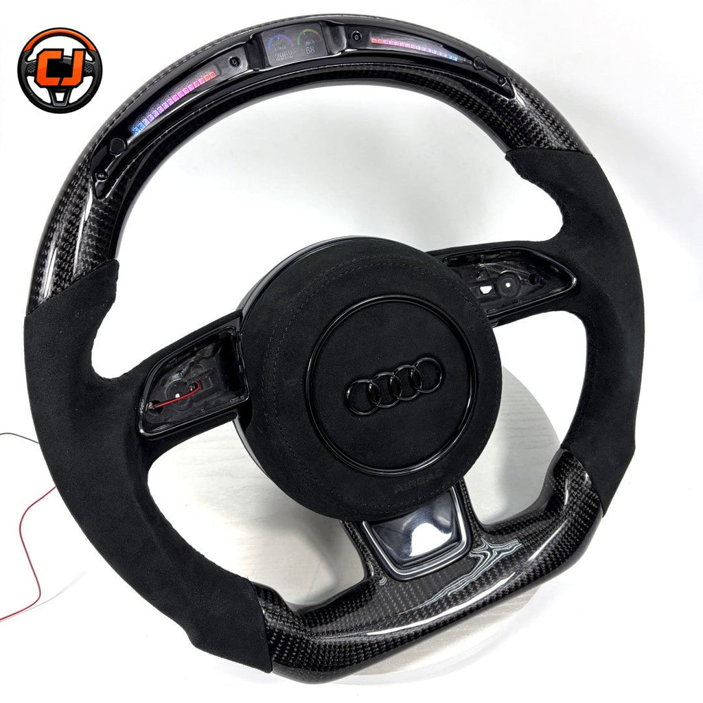 Audi B8 carbon fiber Alcantara LED display steering wheel - angled view showing LED shift bar and digital display lit up