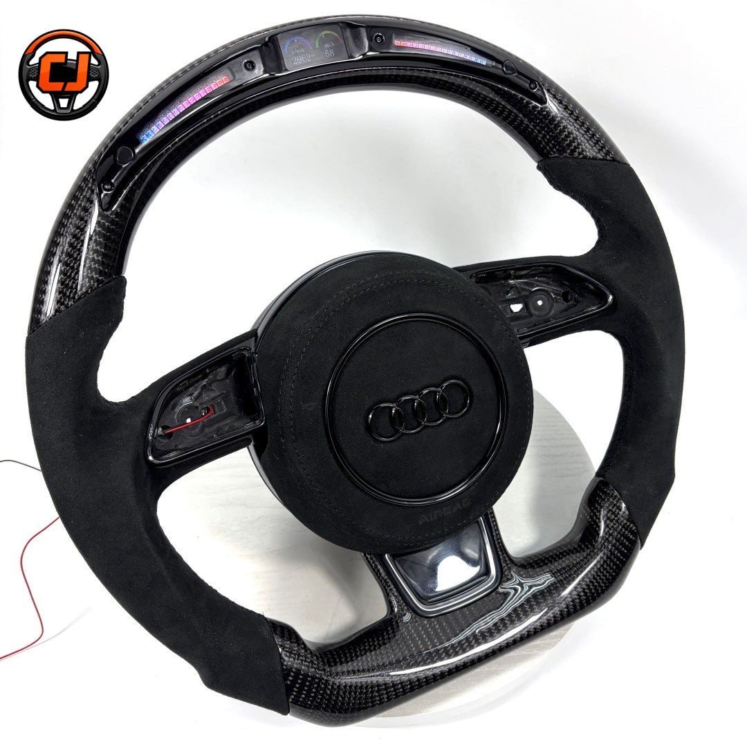 Audi B8 carbon fiber Alcantara LED display steering wheel - angled view showing LED shift bar and digital display lit up