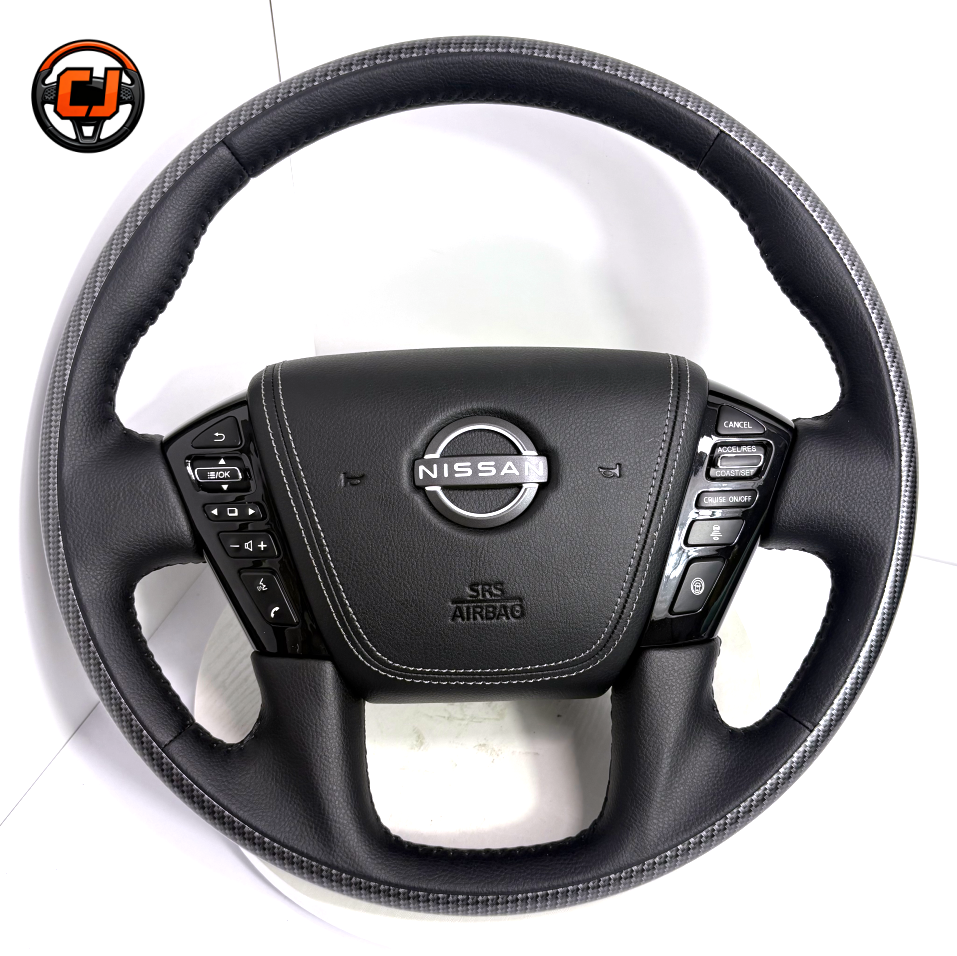 Nissan Patrol Y62 custom steering wheel with carbon fiber outer ring black leather grip factory button compatibility and refined craftsmanship by CJ Mod Garage