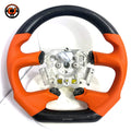 Ford Falcon FG XR6 XR8 flat-bottom steering wheel in carbon fiber and orange perforated leather by CJ Mod Garage