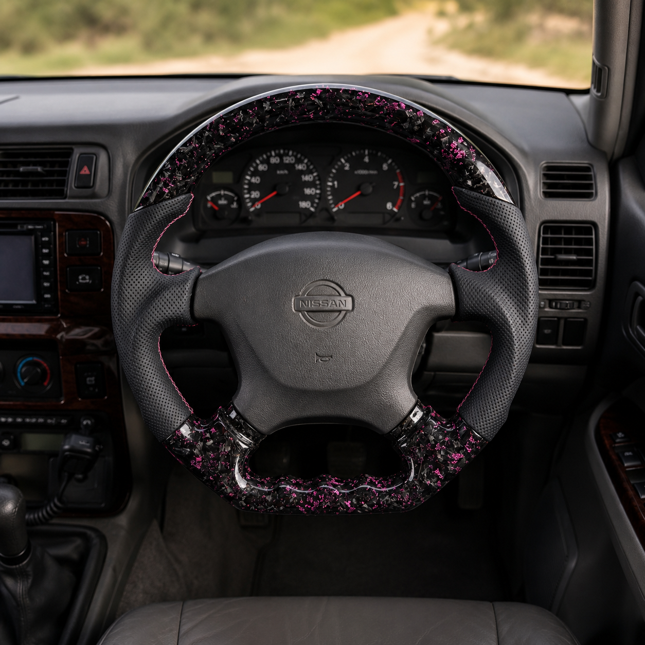 Nissan Patrol Y61 custom forged carbon style steering wheel with pink flakes perforated leather grips and ergonomic performance design by CJ Mod Garage