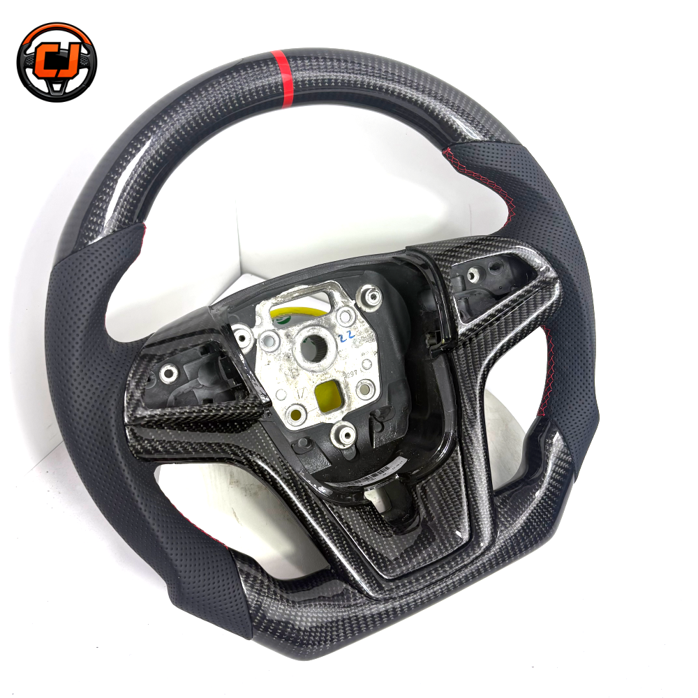 Custom Chevrolet Camaro carbon fiber steering wheel with black perforated leather grips red stitching red center stripe flat bottom design and exposed airbag mounting structure