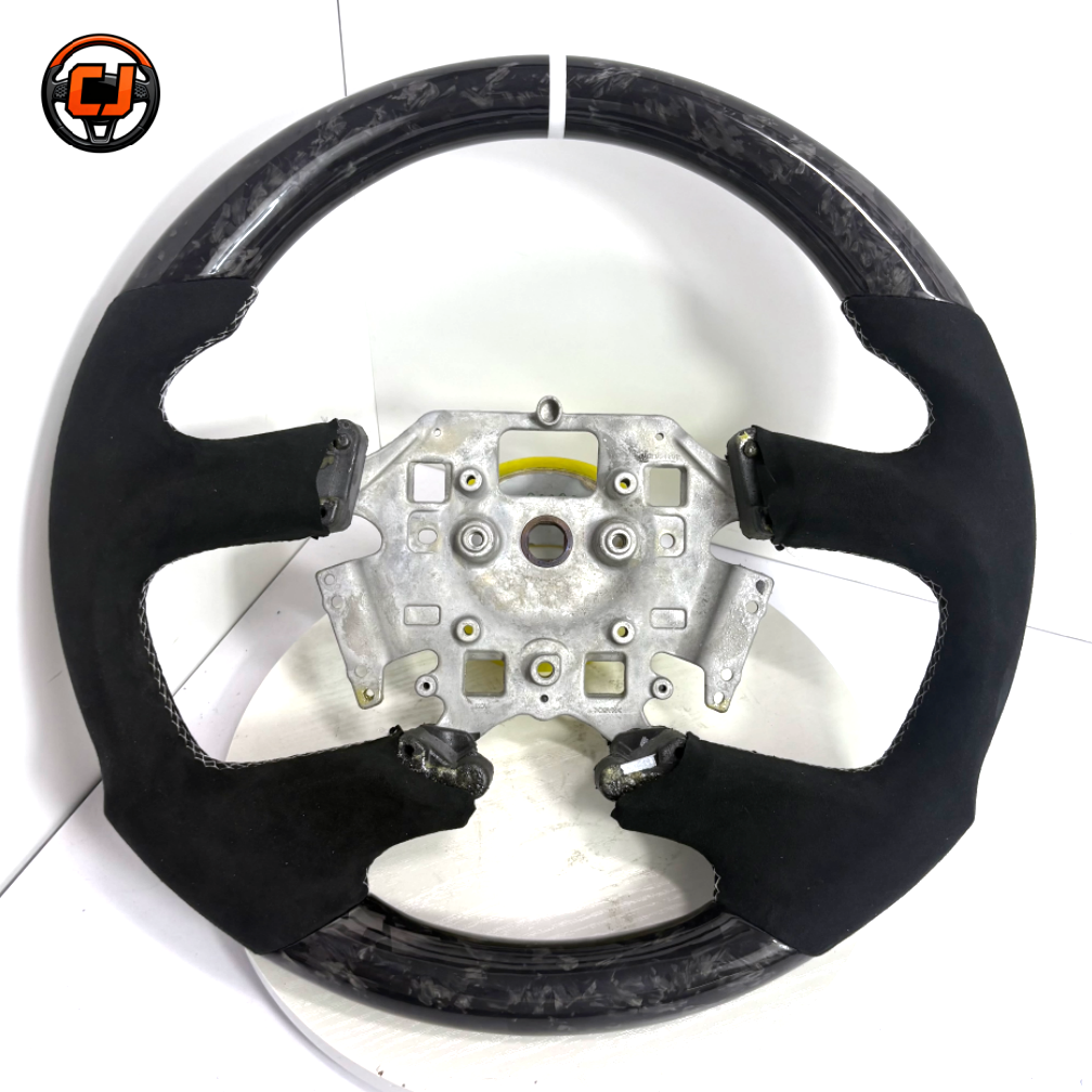 Ford Falcon FG XR XR6 XR8 flat-bottom steering wheel in forged carbon fiber and black Alcantara on white background by CJ Mod Garage