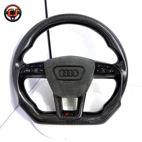 audi rs steering wheel, audi carbon fiber steering wheel, matte carbon fiber steering wheel, audi rs performance wheel, audi black steering wheel, audi sport steering wheel, audi custom steering wheel, carbon fiber car steering wheel, audi rs interior upgrade, audi steering wheel upgrade, audi flat bottom steering wheel, luxury car steering wheel audi, audi rs mod accessories, performance steering wheel audi, audi carbon fiber upgrade
