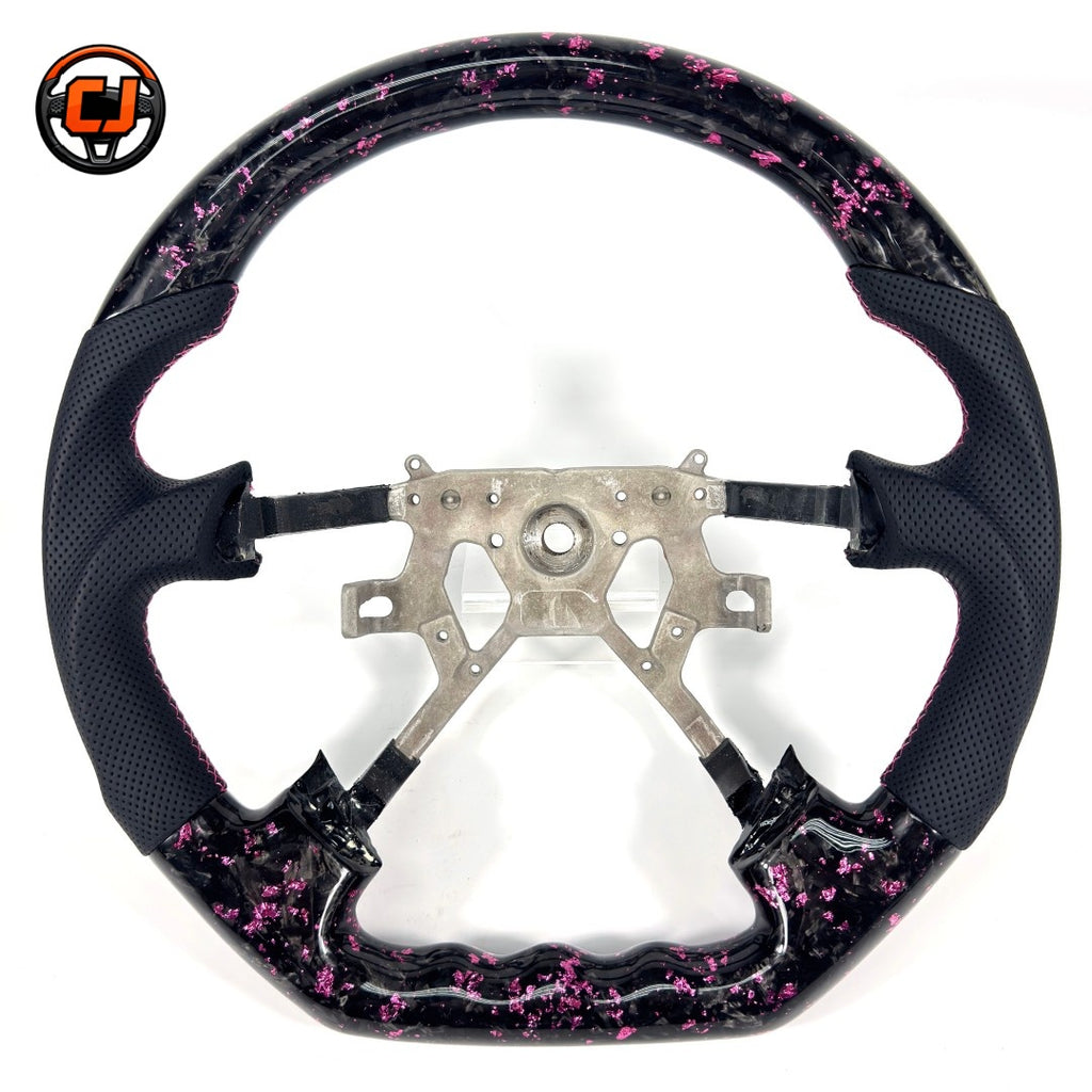 Nissan Patrol Y61 performance steering wheel with black forged carbon effect pink metallic flakes sculpted finger grips and premium leather finish by CJ Mod Garage