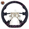 Nissan Patrol Y61 performance steering wheel with black forged carbon effect pink metallic flakes sculpted finger grips and premium leather finish by CJ Mod Garage