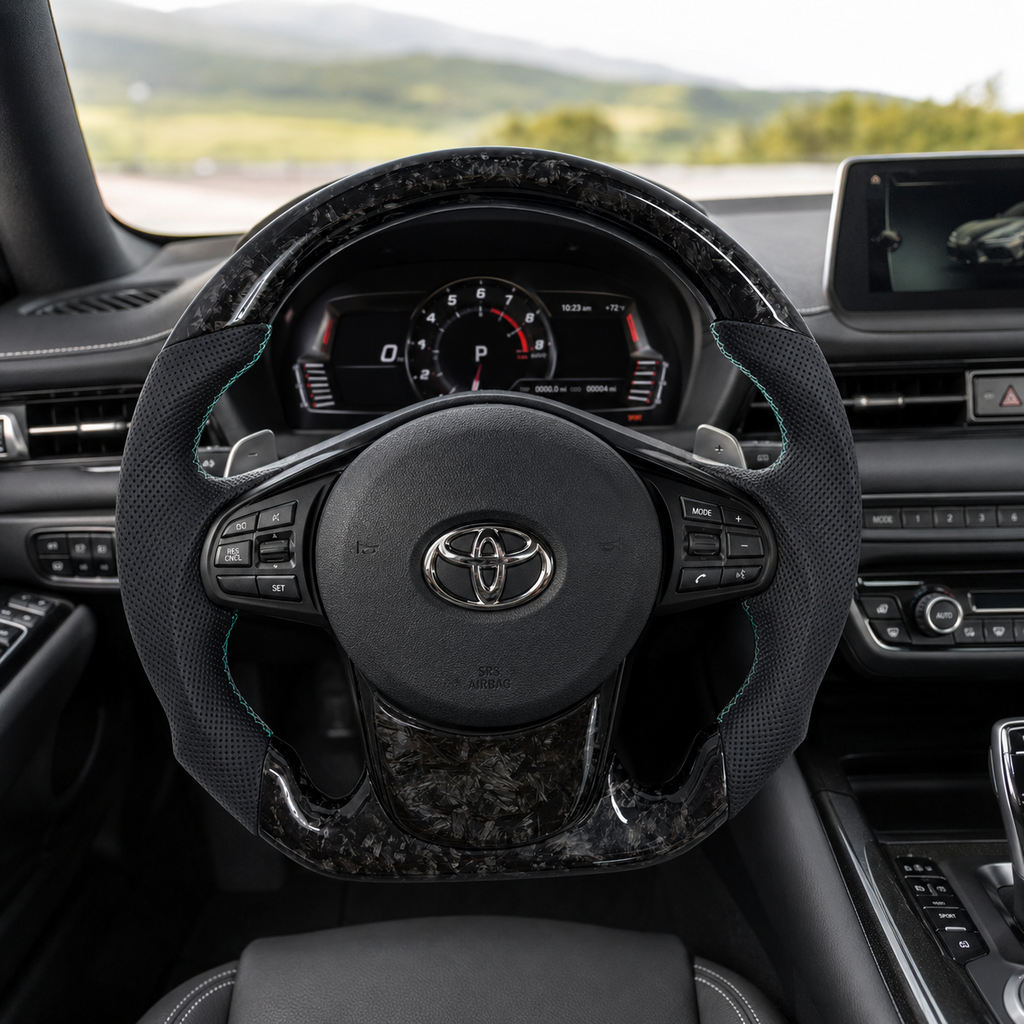 Toyota GR Supra A90 A91 custom forged carbon steering wheel with dark silver flake carbon finish, perforated leather grips and turquoise stitching by CJ Mod Garage