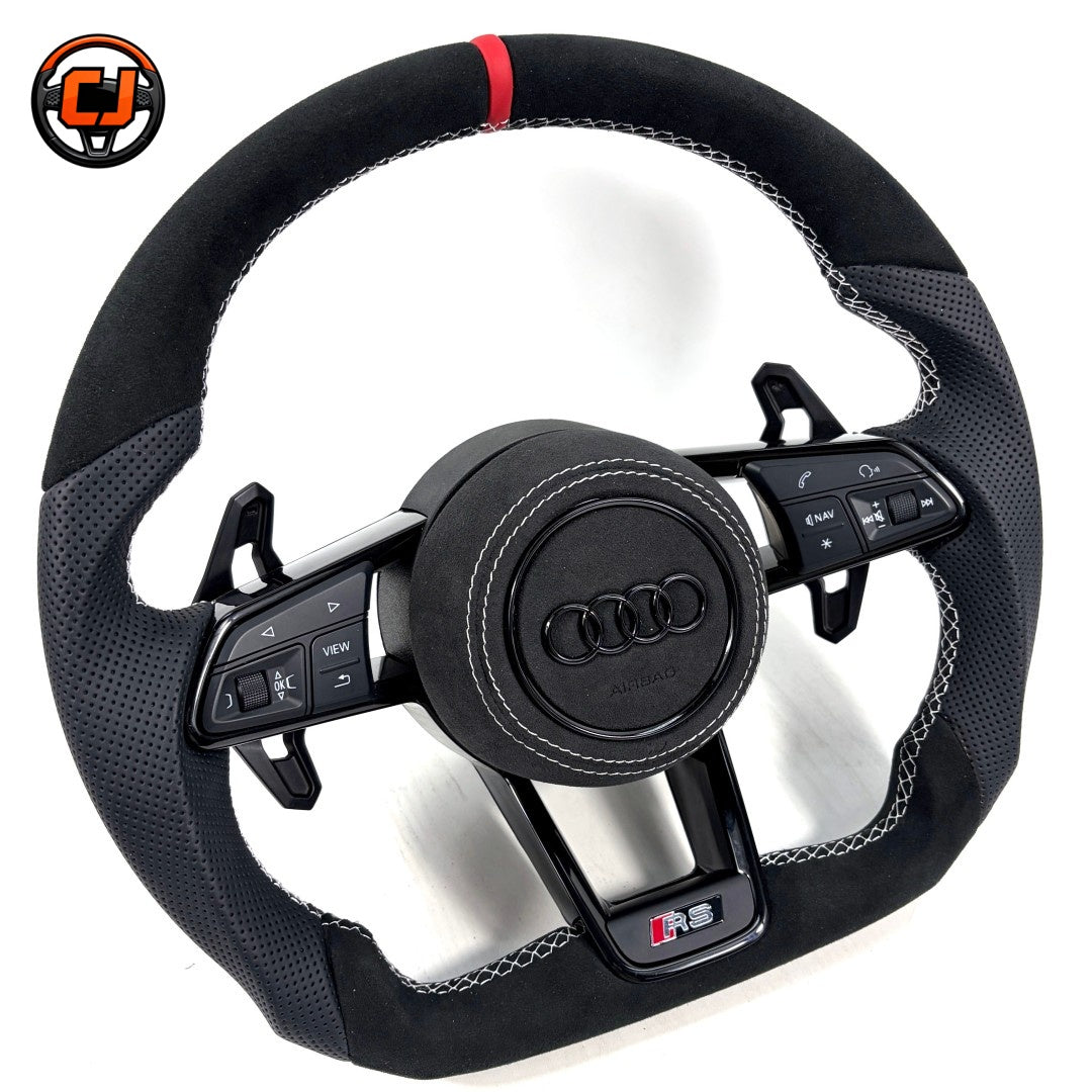 Three quarter product view of Audi R8 style custom steering wheel with black Alcantara perforated leather red center marker white stitching round airbag cover multifunction buttons and paddle shifters compatible with Audi A1 A3 A4 A5 A6 A7 C6 C7 S3 S4 S5 S7 Q3 Q5 Q7 SQ5 RS RS3 RS5 RS6 B8 B9 8P 8V R8 TT