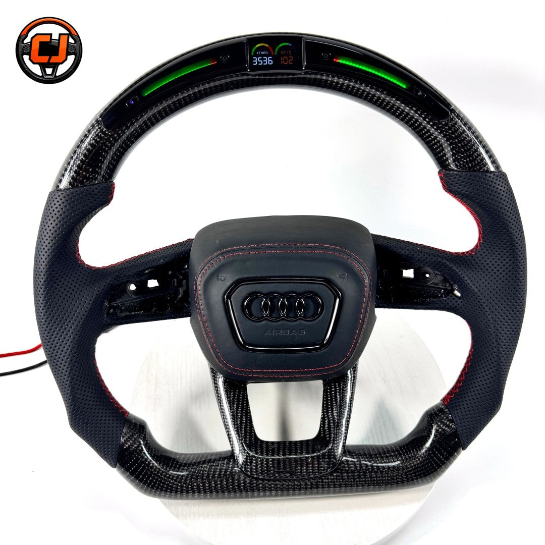 audi steering wheel, carbon fiber steering wheel, audi led steering wheel, audi sport steering wheel, audi custom steering wheel, audi performance wheel, led display steering wheel, audi flat bottom wheel, audi rs steering wheel, audi interior upgrade, carbon fiber audi wheel, audi racing steering wheel, audi red stitch wheel, luxury car steering wheel, aftermarket audi steering wheel
