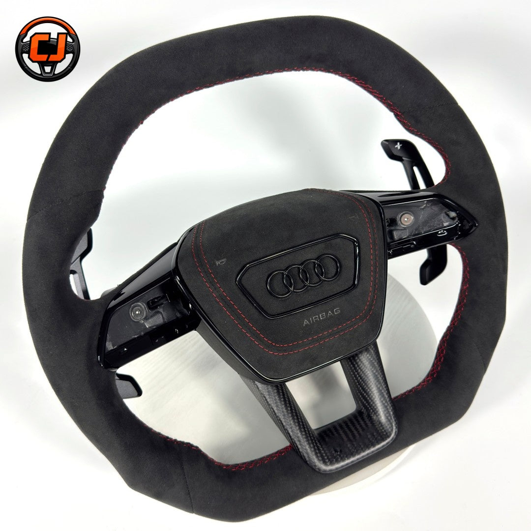 Audi Alcantara carbon fiber trim steering wheel - angled view with paddle shifters