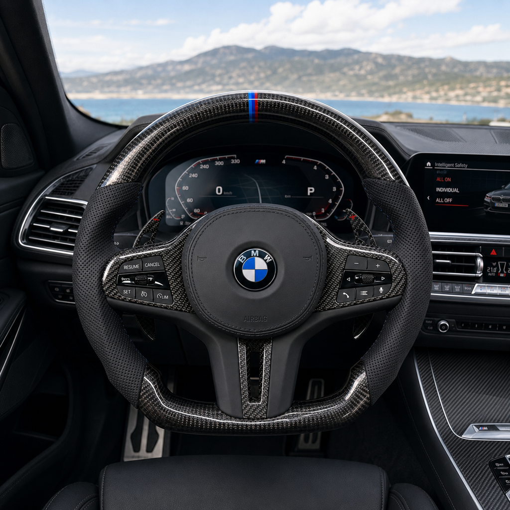CJ Mod Garage BMW custom carbon fiber steering wheel installed in BMW G-chassis interior featuring gloss forged carbon fiber finish, black perforated leather sport grips, flat-bottom M Performance design, M tricolor top stripe, and sporty OEM+ styling compatible with BMW G02 G05 G06 G09 G11 G12 G15 G20 G22 G28 G29 G30 G38 G80 G82 F40 F90