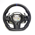 CJ Mod Garage BMW custom carbon fiber steering wheel on white background featuring gloss carbon fiber top and bottom, black perforated leather grips, M tricolor 12 o’clock stripe, flat-bottom sport design, and OEM-style fitment compatible with BMW G02 G05 G06 G09 G11 G12 G15 G20 G22 G28 G29 G30 G38 G80 G82 F40 F90