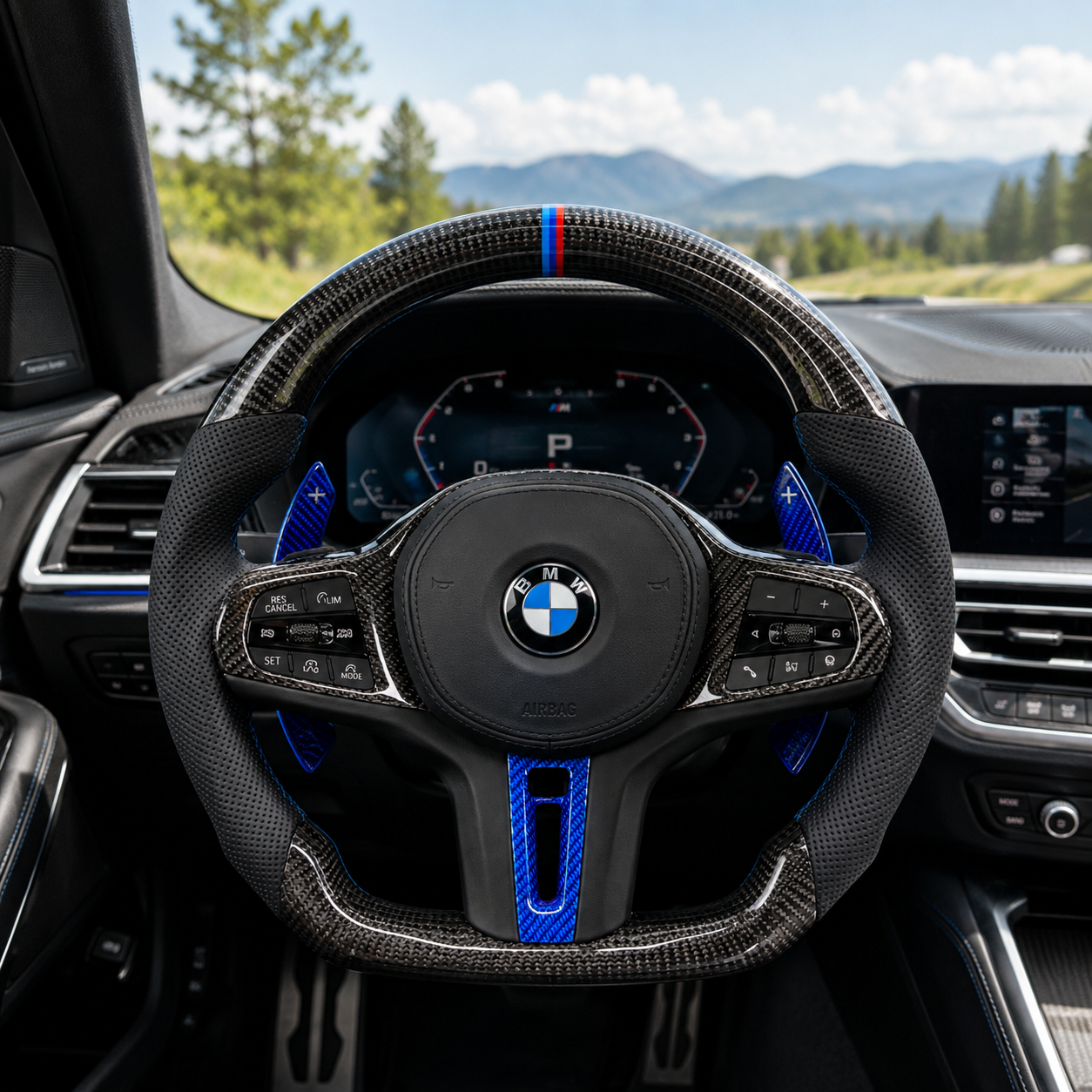 CJ Mod Garage custom BMW carbon fiber steering wheel installed in BMW G-chassis interior featuring gloss carbon fiber finish, black perforated leather grips, blue forged carbon paddle shifters and center trim, M tricolor 12 o’clock stripe, flat-bottom performance design, compatible with BMW G02 G05 G06 G09 G11 G12 G15 G20 G22 G28 G29 G30 G38 G80 G82 F40 F90