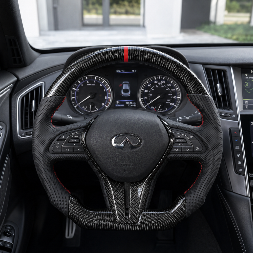 Infiniti Q60 carbon fiber steering wheel installed in vehicle interior with red 12 oclock stripe perforated leather grips and sport styling by CJ Mod Garage