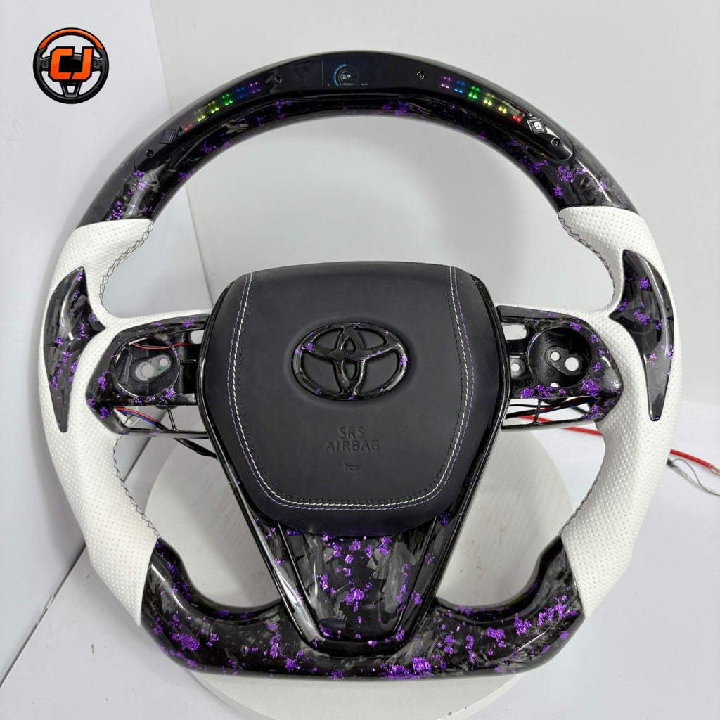 Toyota Avalon RAV4 Highlander compatible forged carbon steering wheel with purple flake finish, white perforated leather and integrated LED shift indicators by CJ Mod Garage