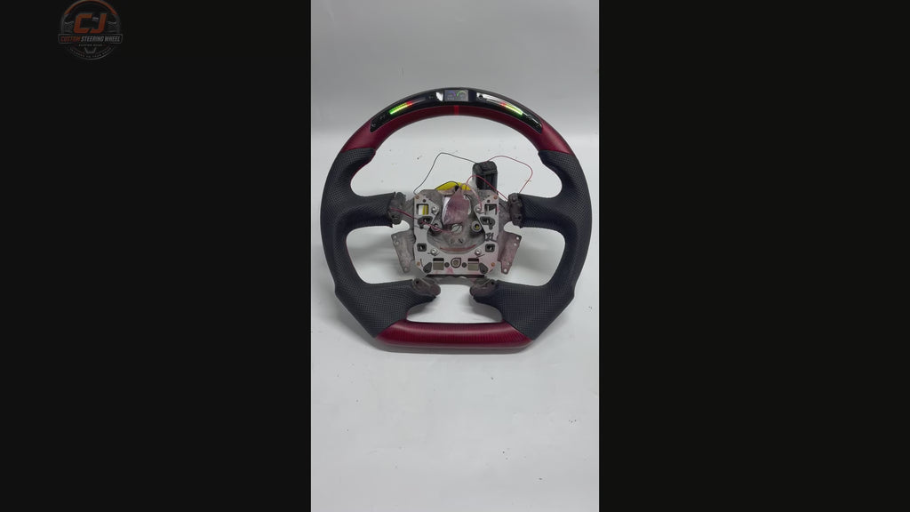 White background video of Ford Falcon FG XR XR6 XR8 steering wheel with LED display red carbon fiber and black perforated leather by CJ Mod Garage