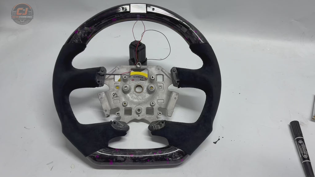 White background product video of Ford Falcon FG XR XR6 XR8 custom steering wheel in LED purple forged carbon and black suede grips by CJ Mod Garage