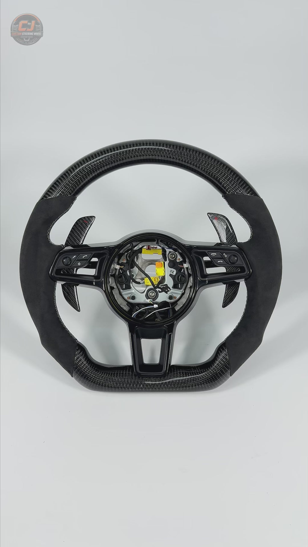 Porsche Custom Steering Wheel Video Highlighting Carbon Fiber Frame Alcantara Grip Sections White Contrast Stitching Airbag Cover and Paddle Shifters for 911 Carrera 996 997 918 Spyder CJ Mod Garage