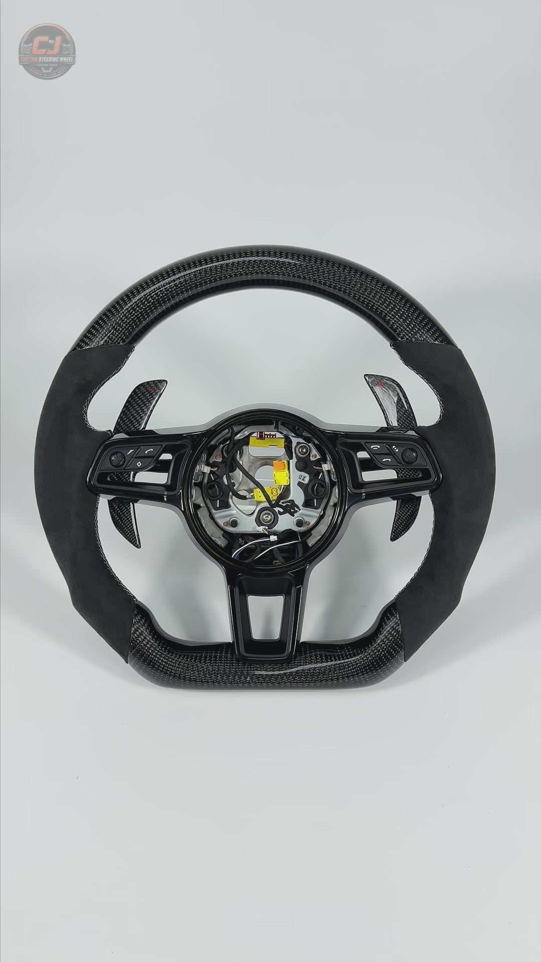 Porsche Custom Steering Wheel Video Highlighting Carbon Fiber Frame Alcantara Grip Sections White Contrast Stitching Airbag Cover and Paddle Shifters for 911 Carrera 996 997 918 Spyder CJ Mod Garage