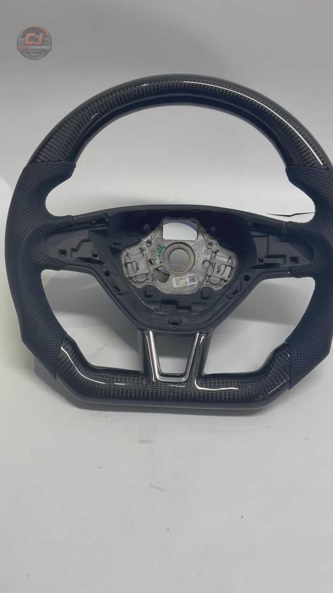 Product showcase video displaying custom Skoda carbon fiber steering wheel with perforated leather grip flat bottom structure and performance inspired styling for Octavia 2014 2020 Superb 2015 2023 Karoq 2018 2024 by CJ Mod Garage