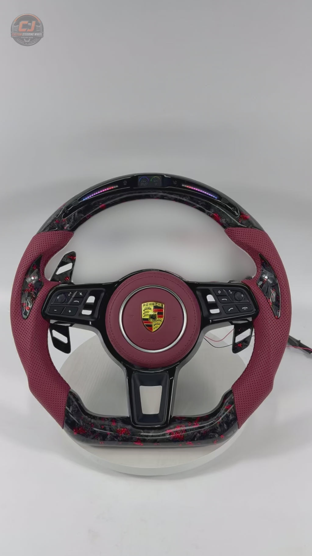 Porsche Custom Steering Wheel Video Showcasing Forged Carbon Red Flake Construction LED Display Red Leather Sections Airbag Cover and Paddle Shifters for 911 996 997 918 Spyder CJ Mod Garage
