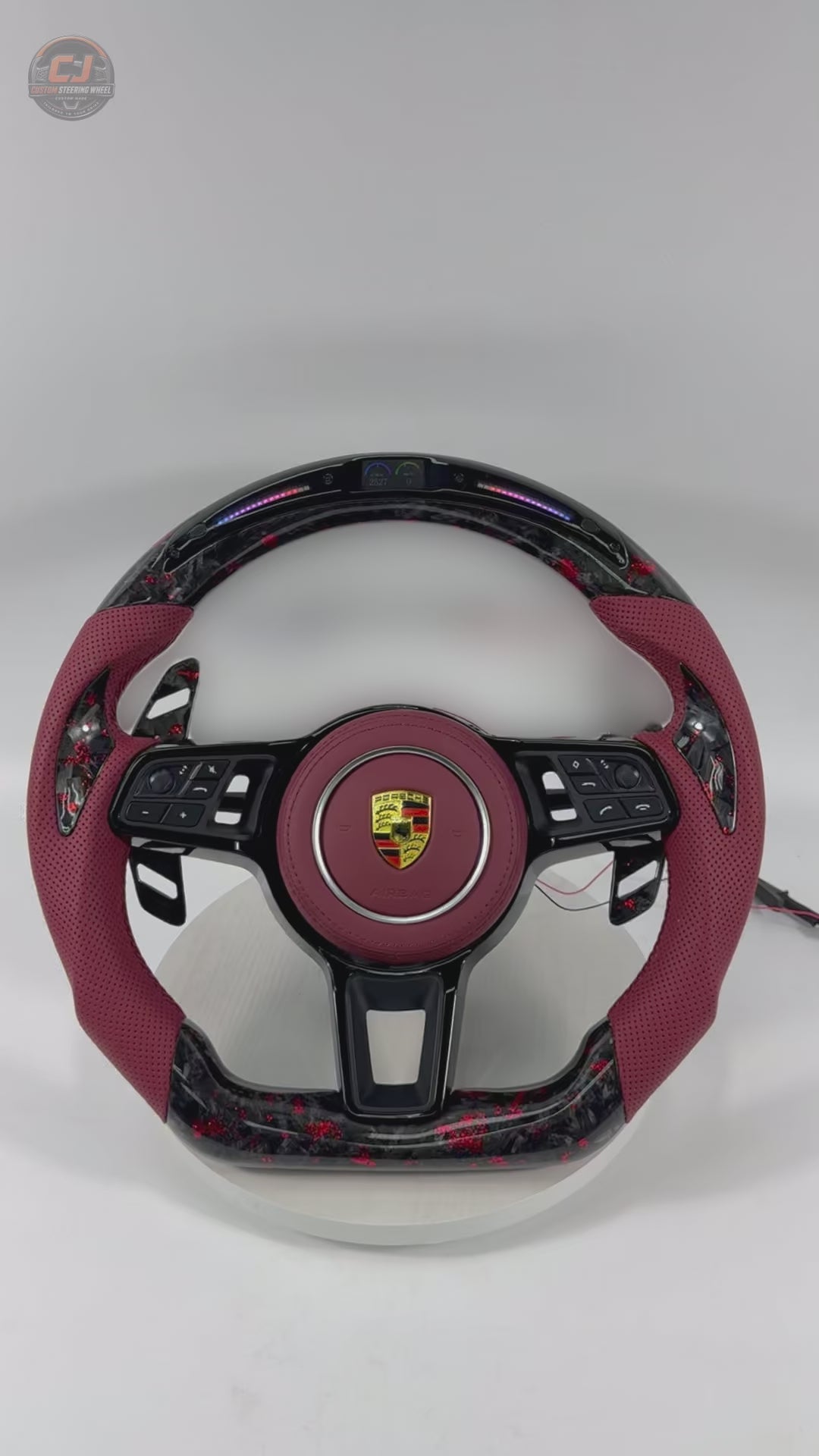 Porsche Custom Steering Wheel Video Showcasing Forged Carbon Red Flake Construction LED Display Red Leather Sections Airbag Cover and Paddle Shifters for 911 996 997 918 Spyder CJ Mod Garage