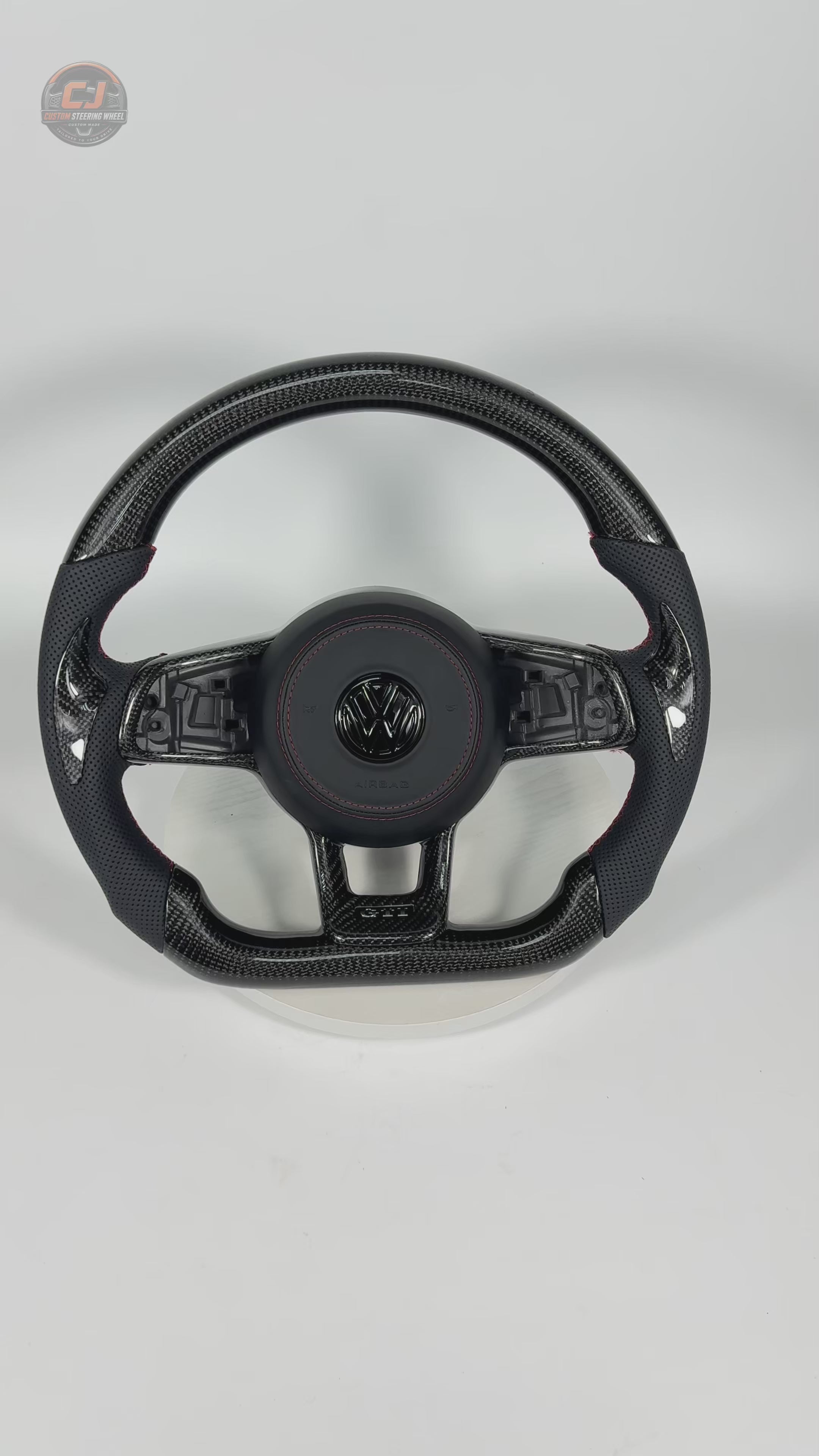 360 degree showcase of custom carbon fiber steering wheel with flat bottom perforated leather grips and red stitching for MK7 GTI Golf 6 7 7.5 R R Line CC Polo Passat B8 by CJ Mod Garage