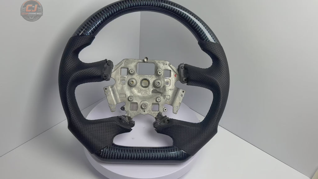 White background product video of Ford Falcon FG XR XR6 XR8 custom steering wheel in blue carbon fiber black perforated leather by CJ Mod Garage