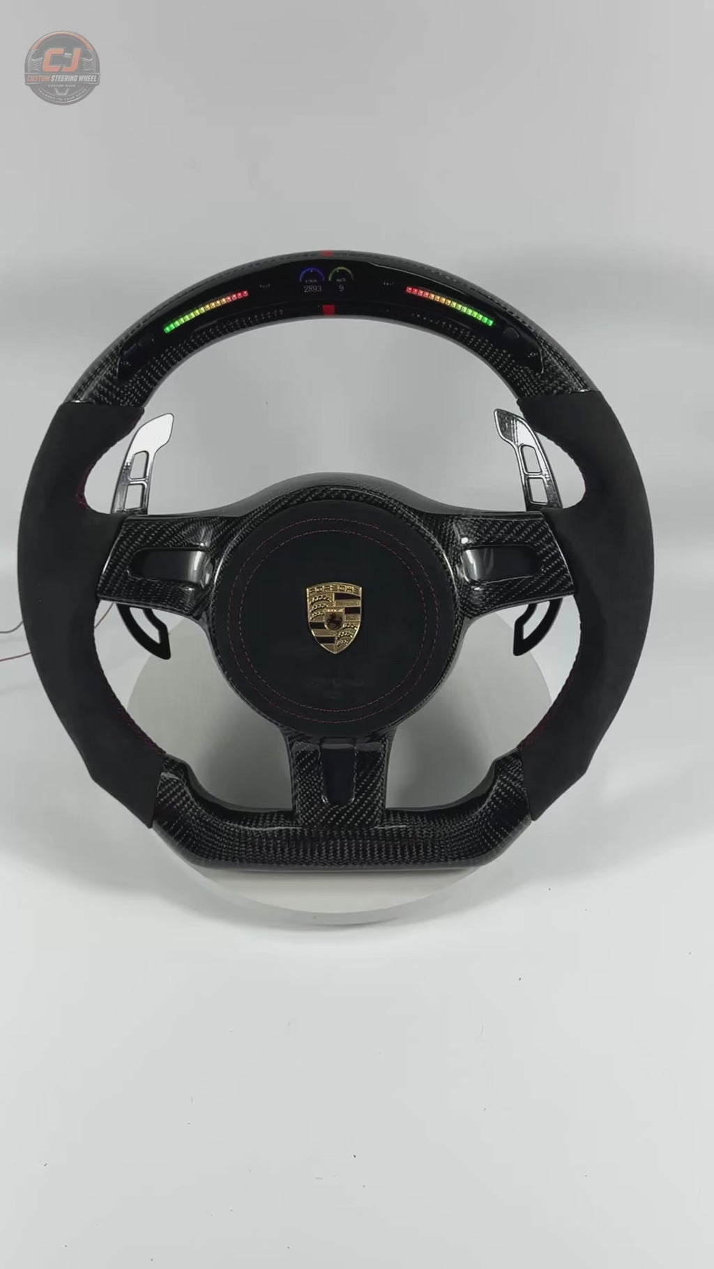 Porsche Custom Carbon Fiber Steering Wheel Video Showcasing LED Shift Lights Alcantara Grip Sections Red Stitching Airbag Cover and Racing Paddle Shifters for Panamera Cayenne Macan Taycan CJ Mod Garage