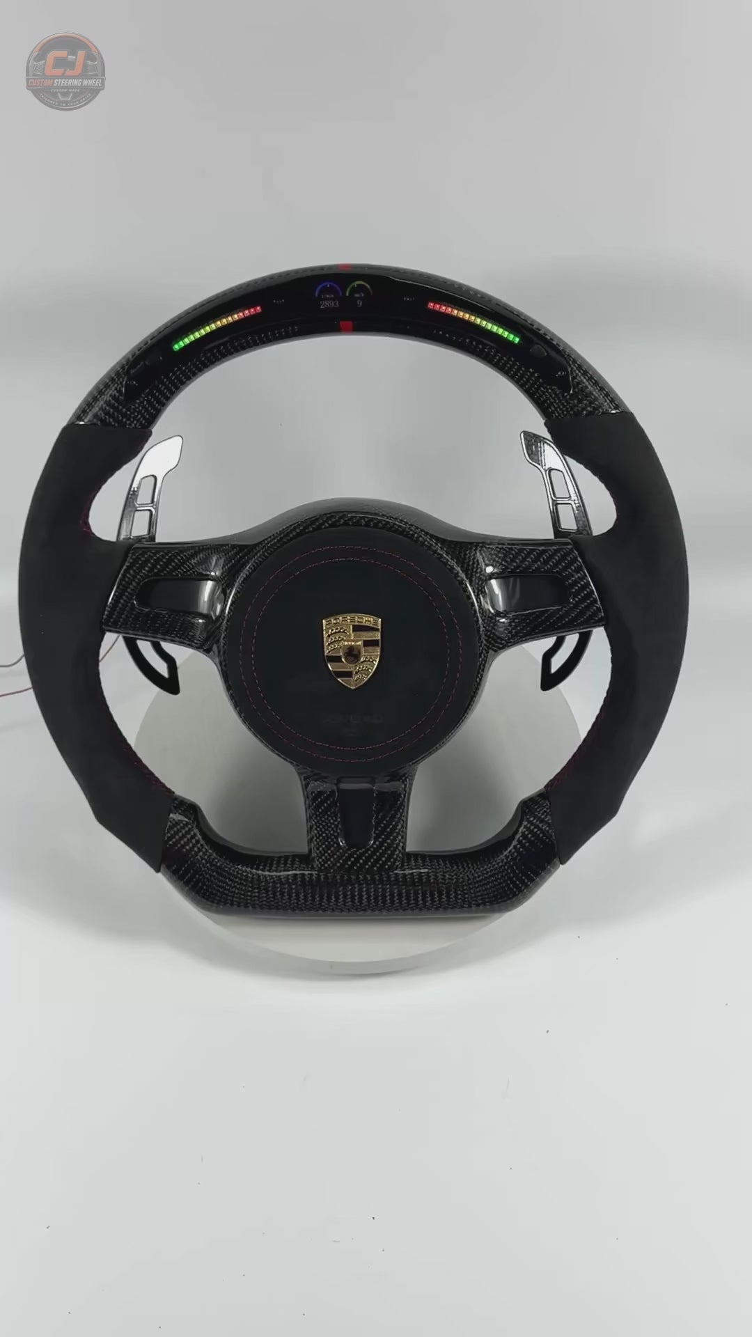 Porsche Custom Carbon Fiber Steering Wheel Video Showcasing LED Shift Lights Alcantara Grip Sections Red Stitching Airbag Cover and Racing Paddle Shifters for Panamera Cayenne Macan Taycan CJ Mod Garage