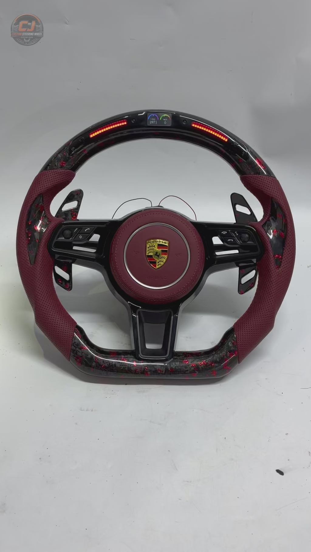 Porsche Forged Carbon Steering Wheel Video Showing Red Flake Carbon Finish Burgundy Leather Grip LED RPM Display and Custom Airbag Cover for Panamera Cayenne Macan Taycan Cayman Boxster CJ Mod Garage