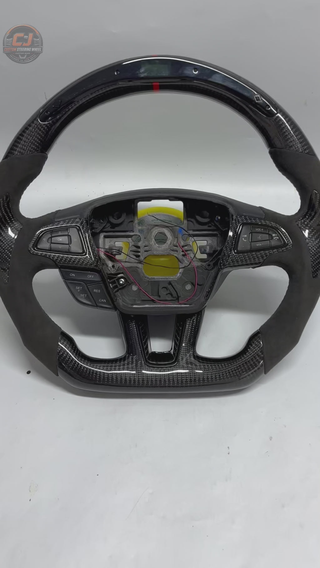 Ford Focus carbon fiber flat-bottom custom steering wheel white background product video by CJ Mod Garage