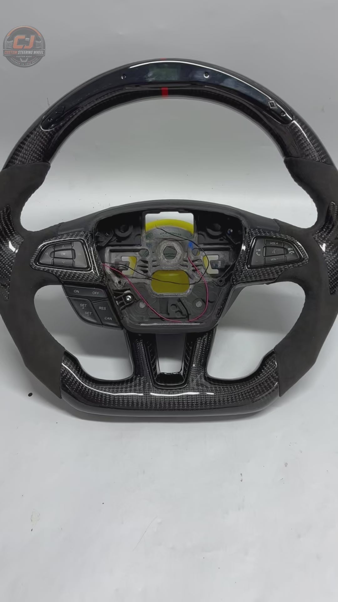 Ford Focus carbon fiber flat-bottom custom steering wheel white background product video by CJ Mod Garage