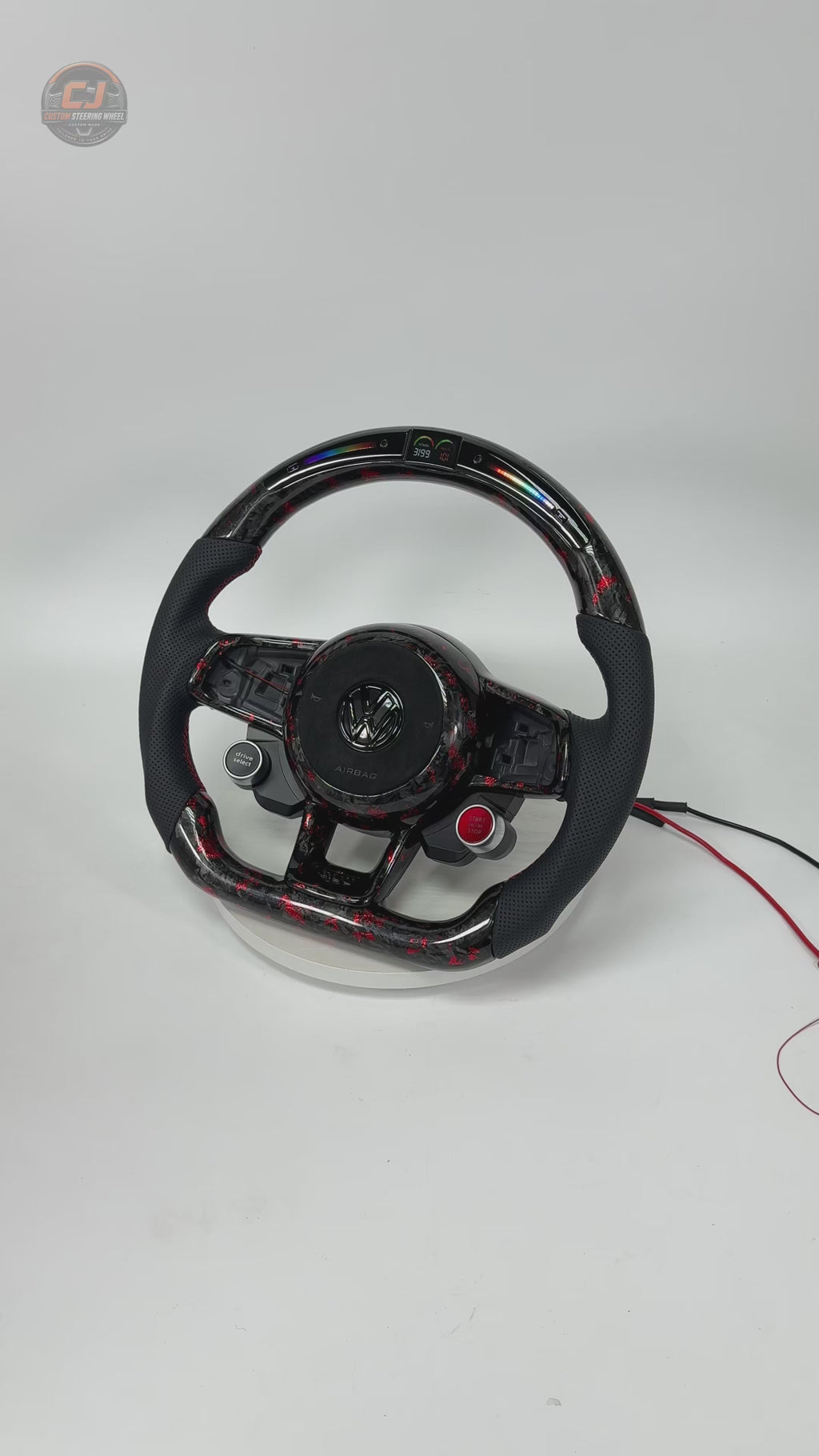 White studio video of a red forged carbon LED steering wheel display for MK7 GTI Golf 6 7 7 5 R R Line CC Polo Passat B8 CJ Mod Garage