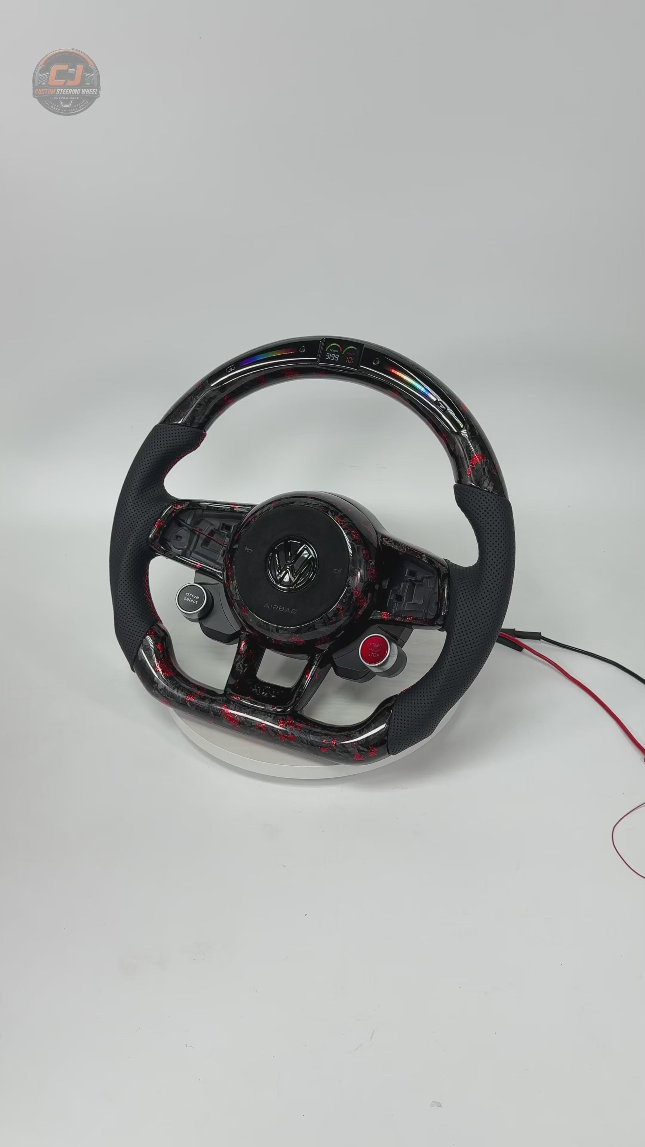 White studio video of a red forged carbon LED steering wheel display for MK7 GTI Golf 6 7 7 5 R R Line CC Polo Passat B8 CJ Mod Garage