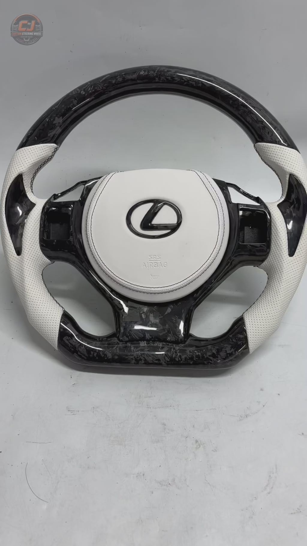 Custom Lexus Steering Wheel Video Showcasing White Perforated Leather Forged Carbon Texture Flat Bottom Profile And Premium Handcrafted Details For Lexus IS 2014 2020 RC 2015 2020 GS 2013 2020 NX 2015 2021 CT 2014 2022 CJ Mod Garage