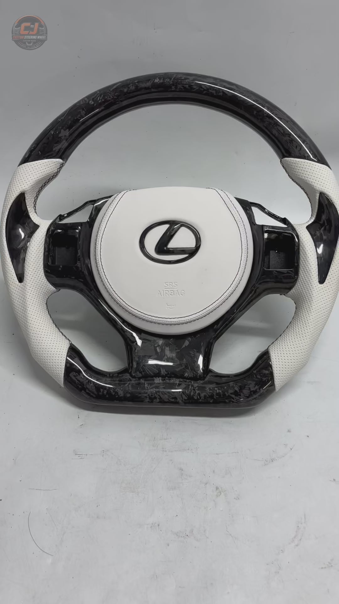 Custom Lexus Steering Wheel Video Showcasing White Perforated Leather Forged Carbon Texture Flat Bottom Profile And Premium Handcrafted Details For Lexus IS 2014 2020 RC 2015 2020 GS 2013 2020 NX 2015 2021 CT 2014 2022 CJ Mod Garage