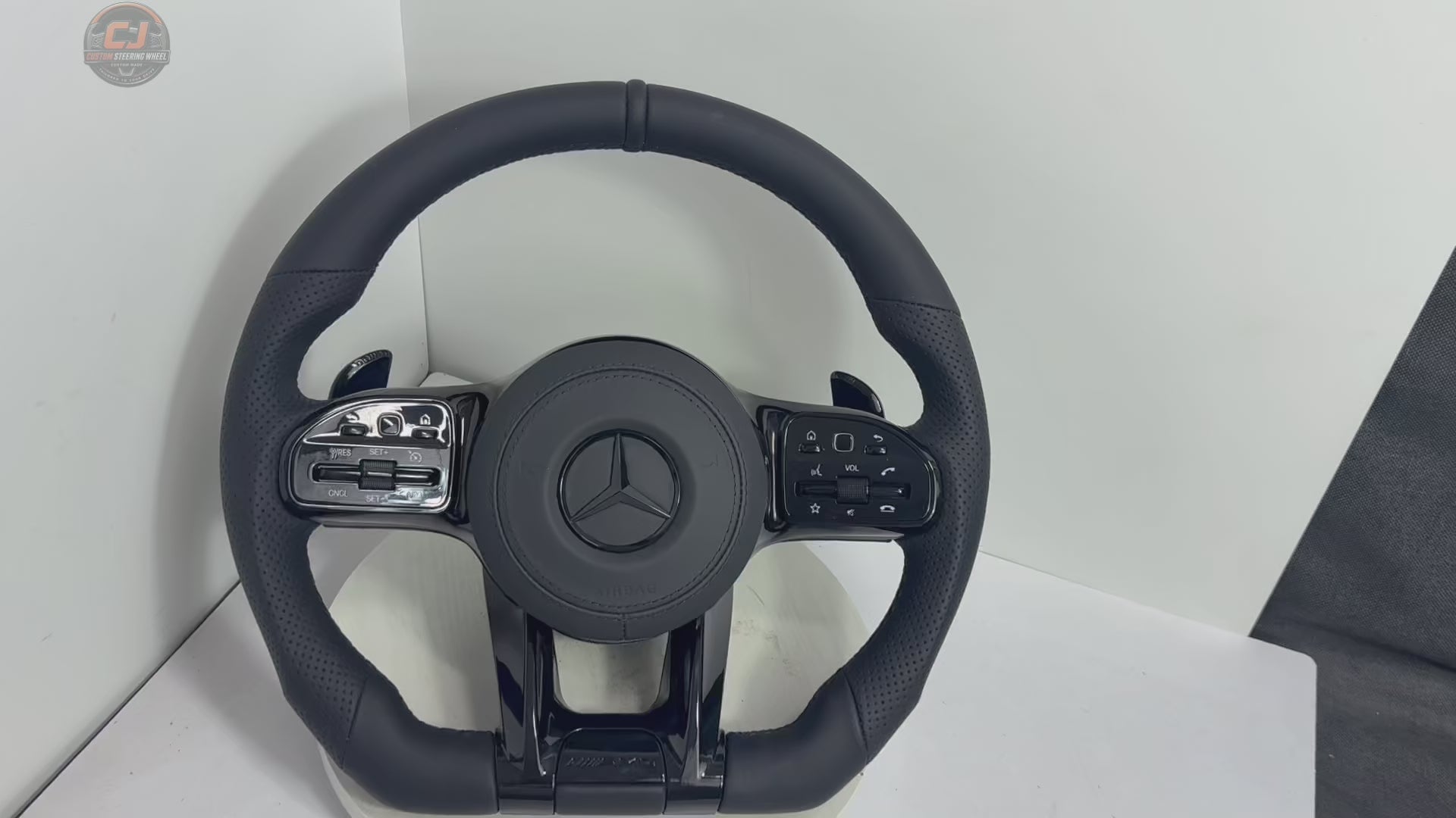 White background Mercedes AMG leather steering wheel video with perforated grips and sporty OEM style for W117 W176 W177 W203 W204 W205 W211 W212 W213 W218 C43 C63 C200 C300 CJ Mod Garage