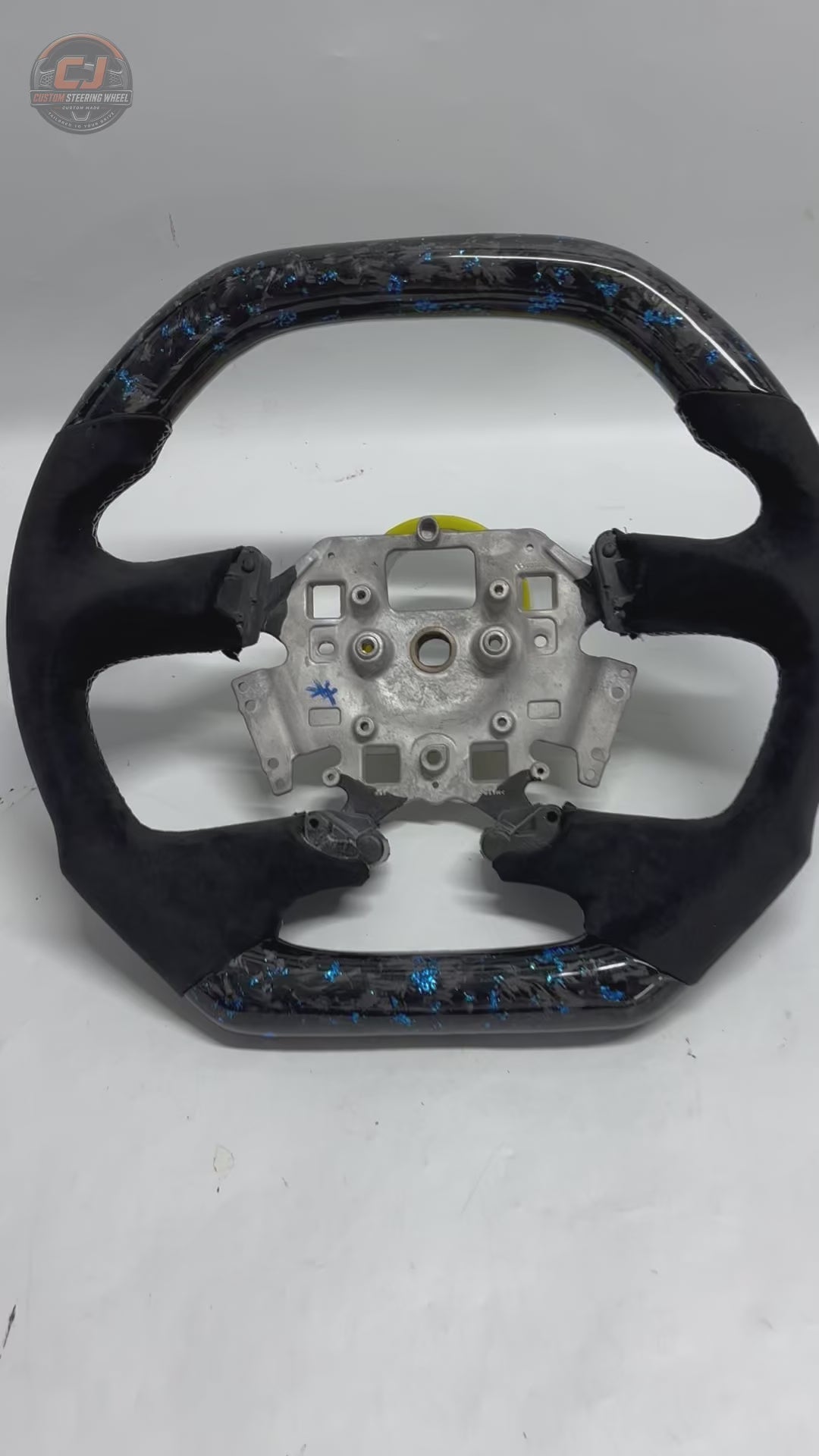 White background product video of Ford Falcon FG XR XR6 XR8 custom steering wheel in blue flake forged carbon and black Alcantara by CJ Mod Garage