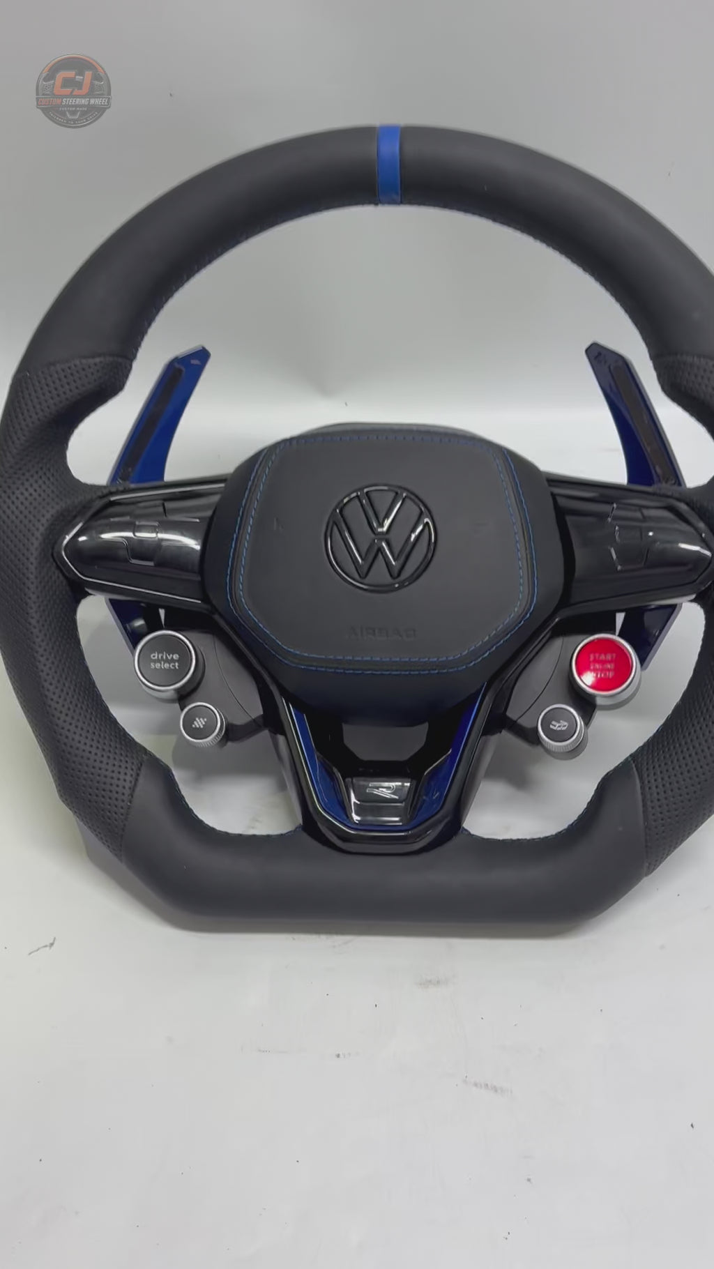 Product showcase video highlighting custom leather steering wheel with blue paddle shifters flat bottom profile and multifunction controls for Golf 8 MK8 Passat Touareg Tiguan Polo GTD MK7 MK6 R Line CC Jetta by CJ Mod Garage
