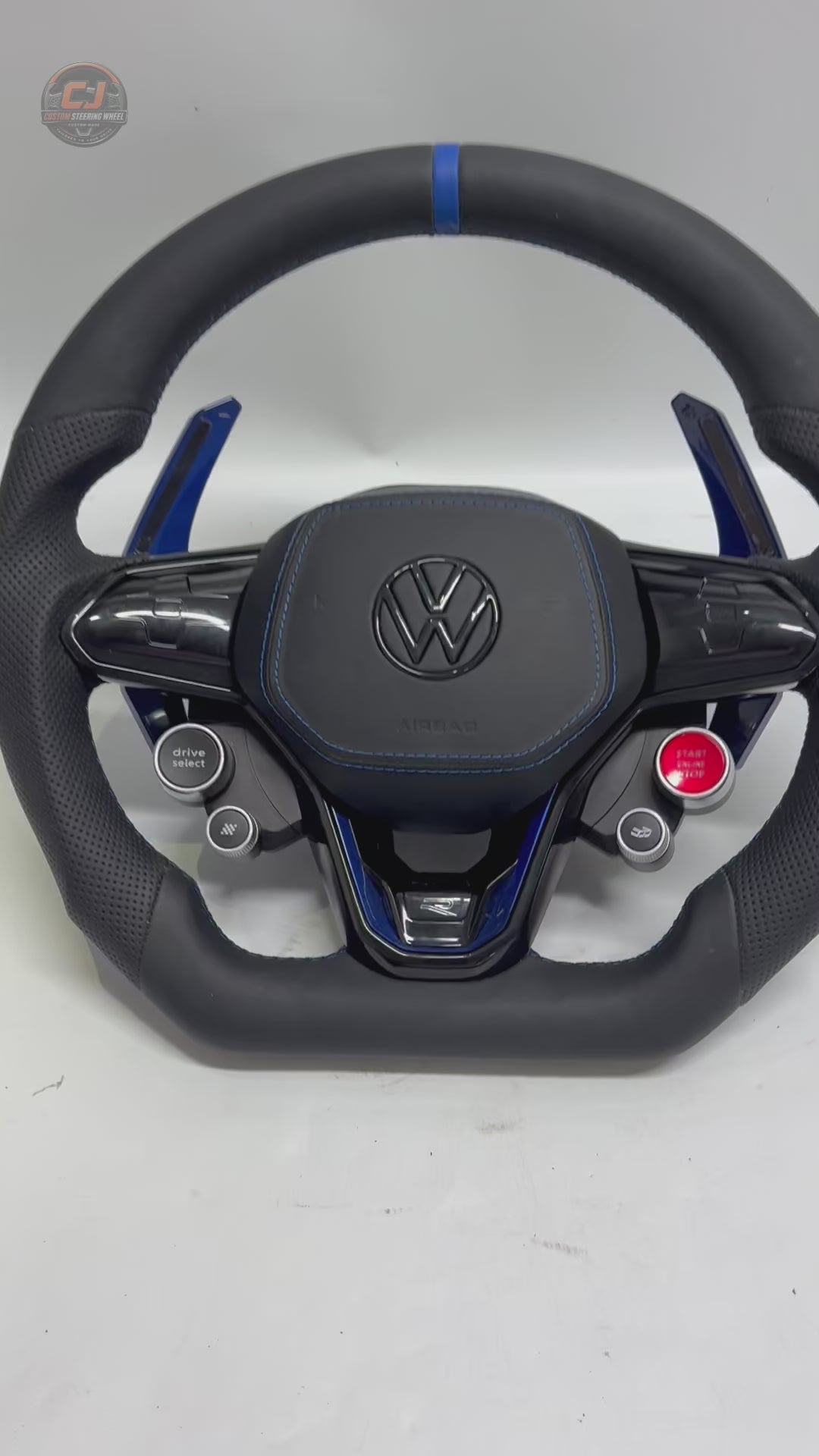 Product showcase video highlighting custom leather steering wheel with blue paddle shifters flat bottom profile and multifunction controls for Golf 8 MK8 Passat Touareg Tiguan Polo GTD MK7 MK6 R Line CC Jetta by CJ Mod Garage