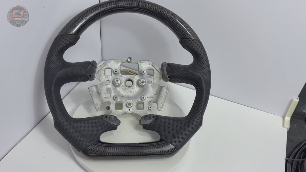 White background video of Ford Falcon FG XR XR6 XR8 carbon fiber and black perforated leather steering wheel by CJ Mod Garage