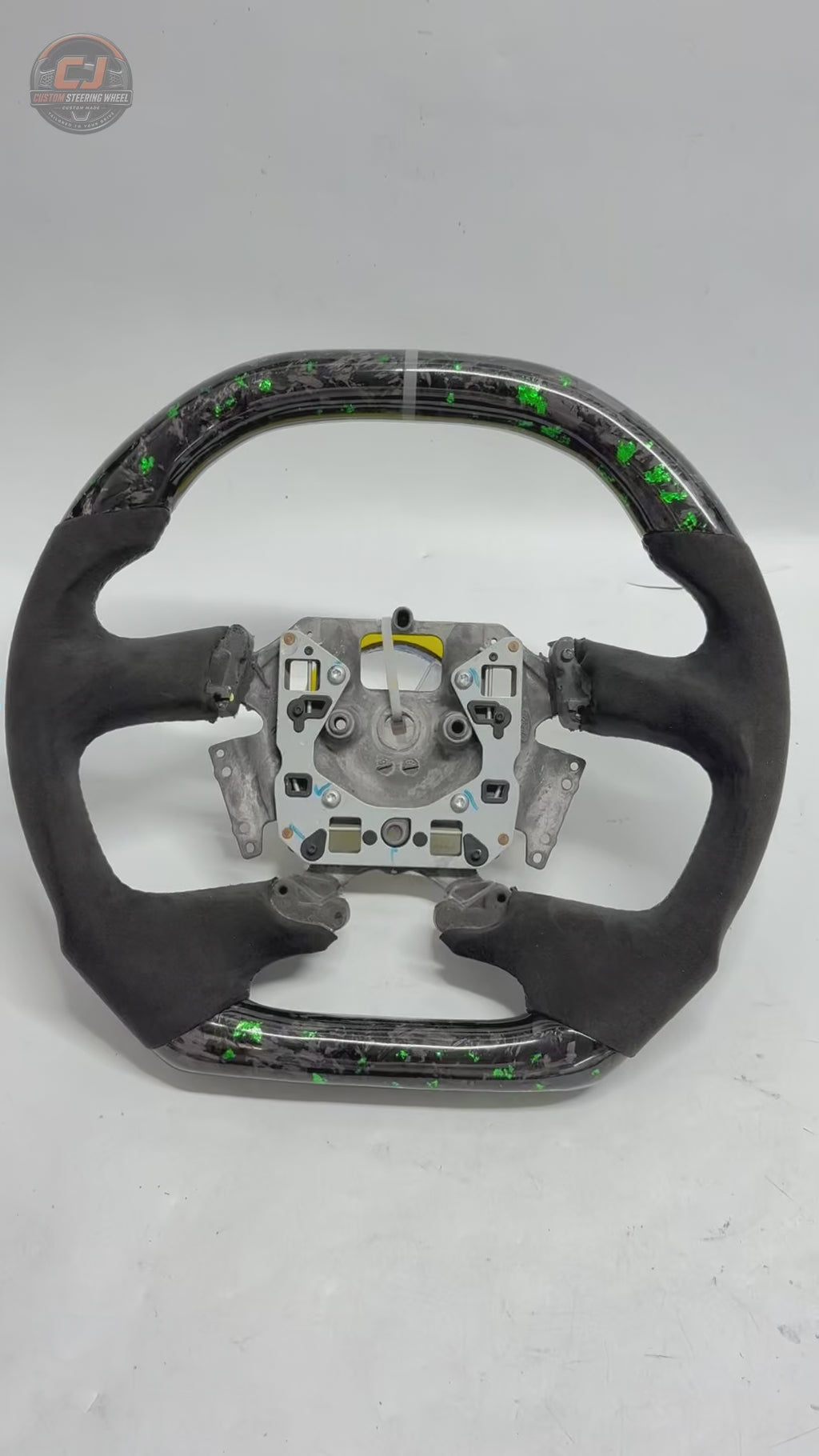 White background product video of Ford Falcon FG XR XR6 XR8 custom steering wheel in green flake forged carbon and black Alcantara by CJ Mod Garage